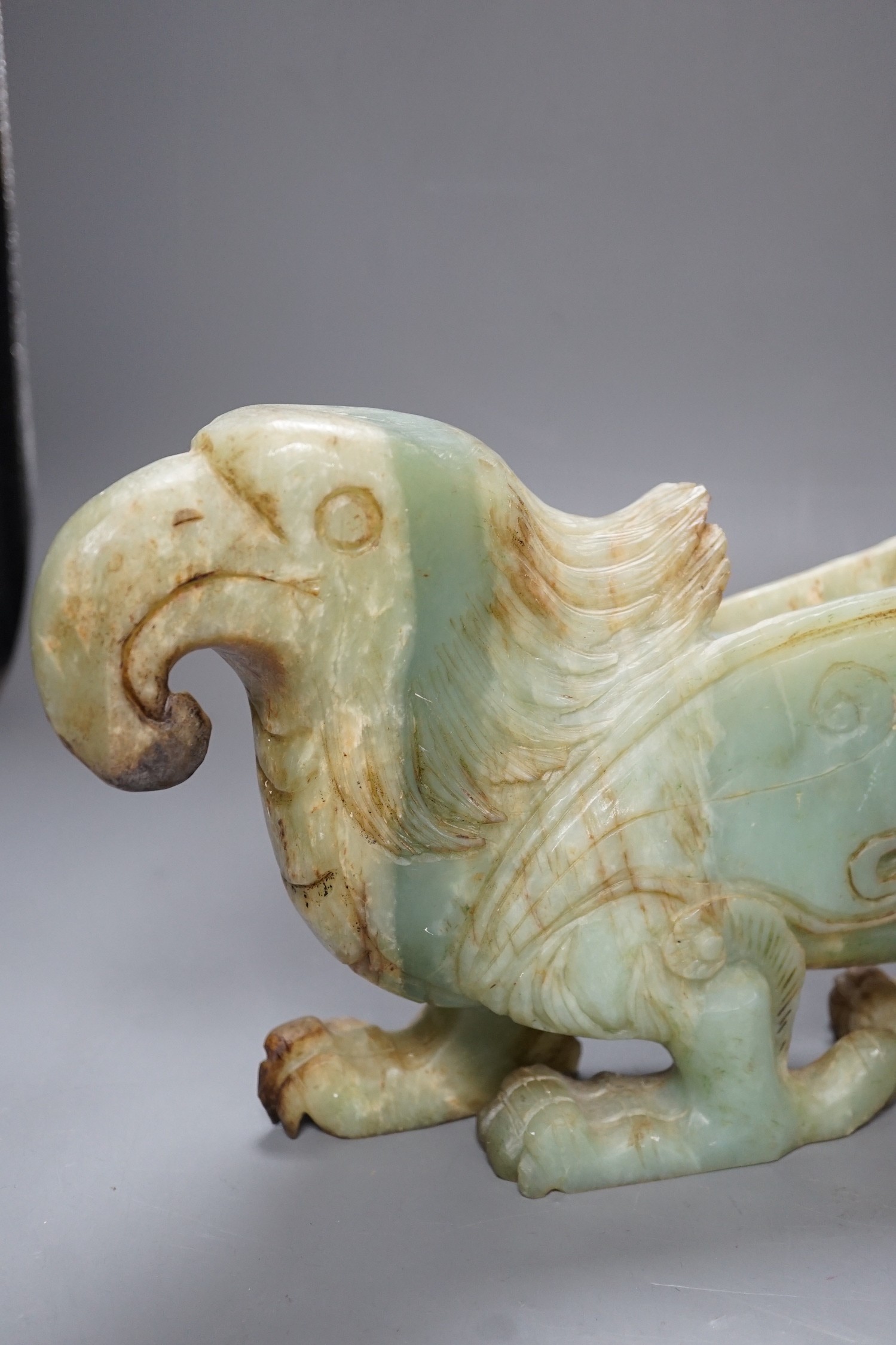 A large Chinese bowenite jade figure of a winged mythical beast, 46cm long